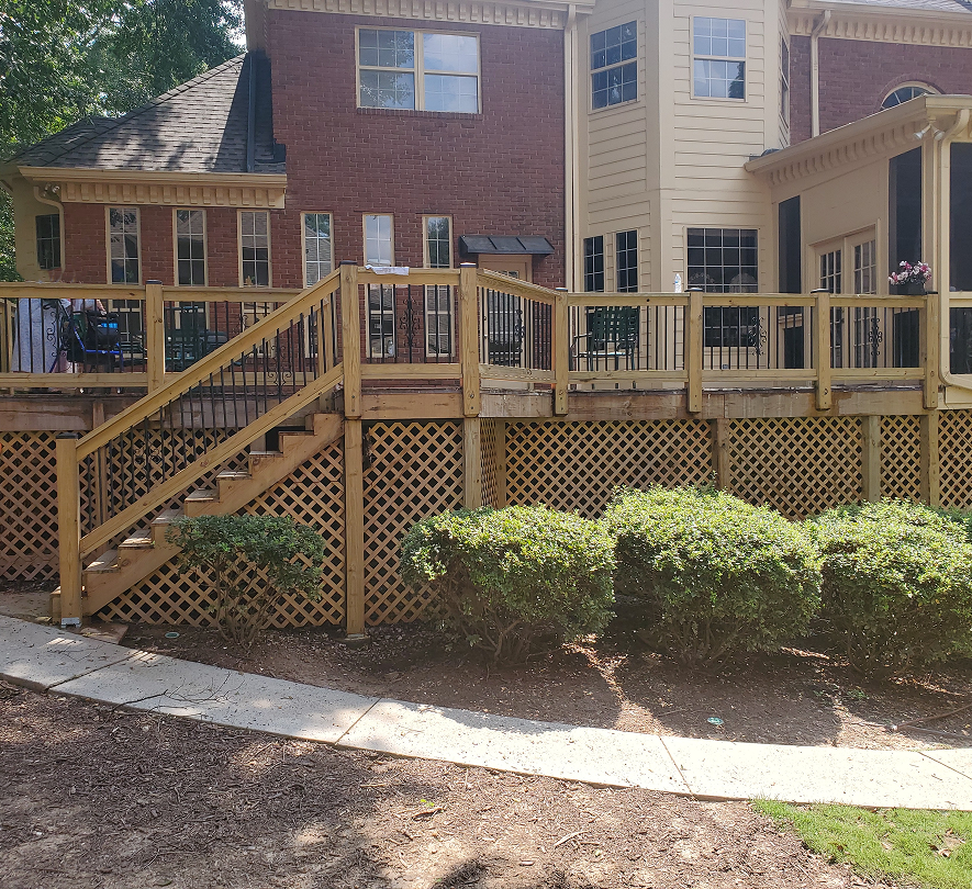 House exterior with large wooden deck