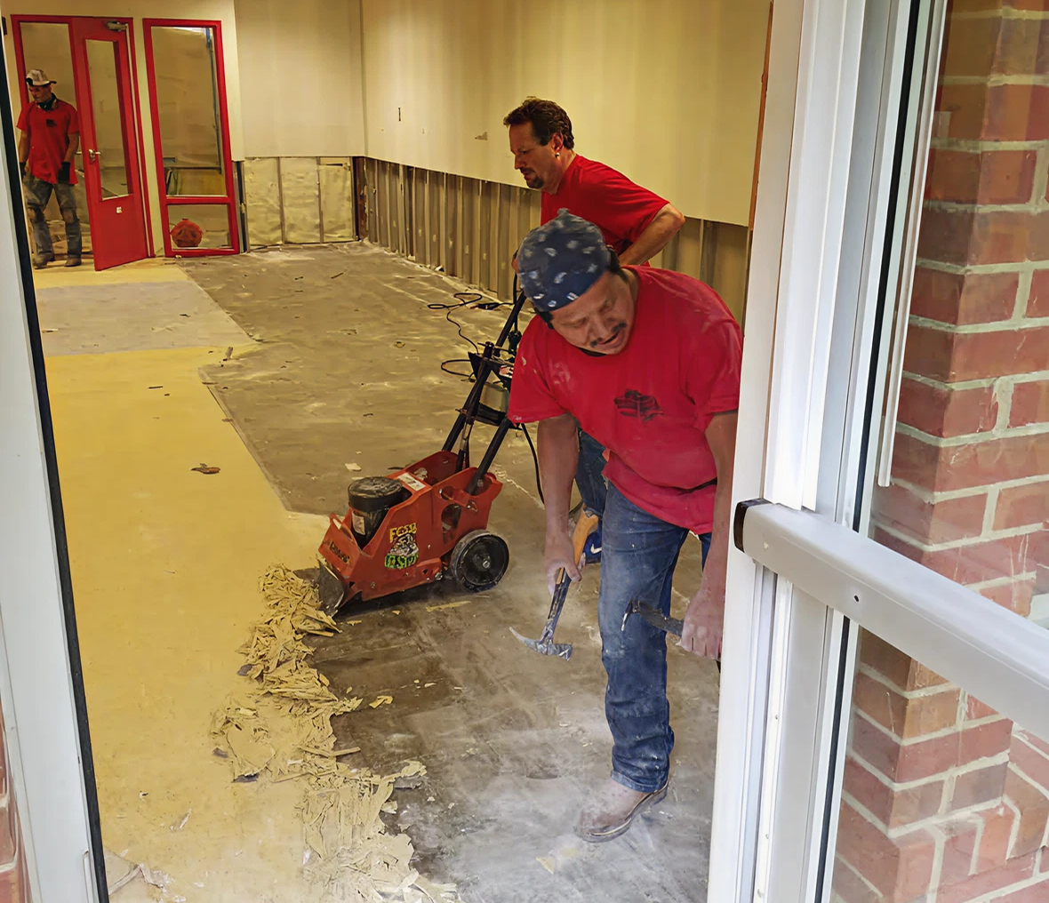 Men using tools for floor removal
