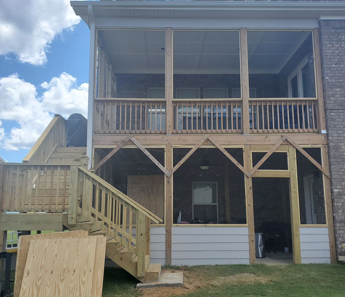 House with elevated wooden deck structure