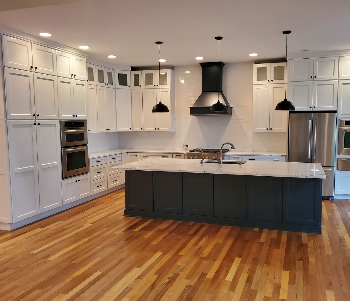 Modern kitchen with island and wooden floor