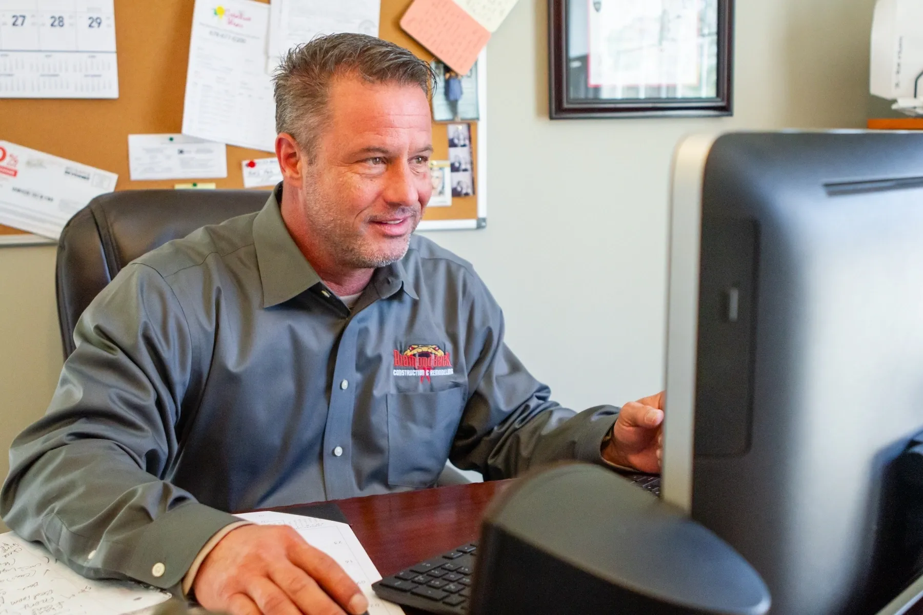 Businessman smiling at desk